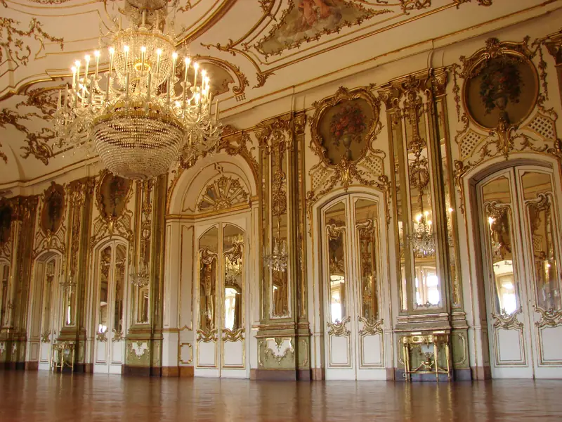 Gilded hall with mirrors and crystal chandeliers