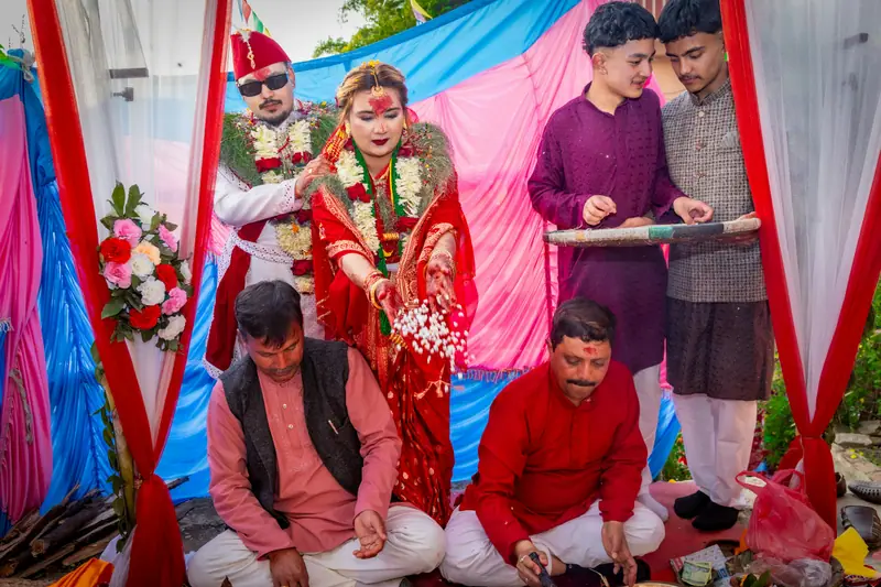 Family gathered around the sacred fire during the wedding ceremony