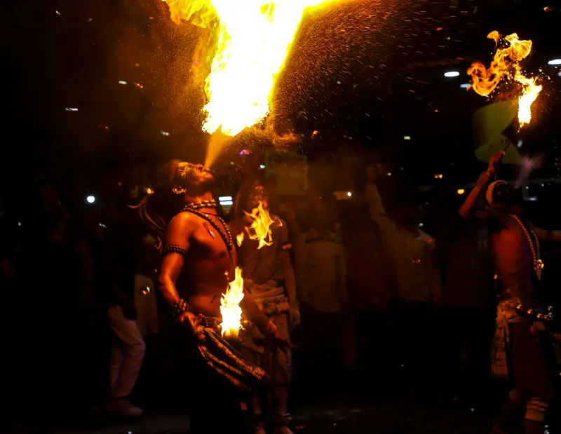 Fire performers at a night-time wedding celebration